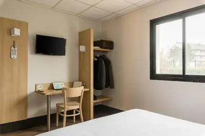 Un ou plusieurs lits dans un hébergement de l'établissement B&B HOTEL Rouen Saint-Étienne-du-Rouvray