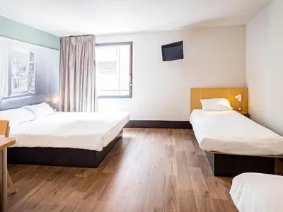 Un ou plusieurs lits dans un hébergement de l'établissement B&B HOTEL Rouen Saint-Étienne-du-Rouvray