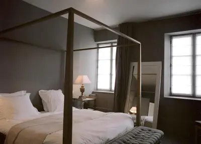 Un ou plusieurs lits dans un hébergement de l'établissement Hôtel La Licorne & Spa