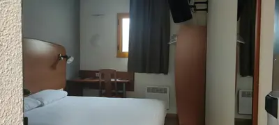 Un ou plusieurs lits dans un hébergement de l'établissement Welcomotel Beauvais Aéroport