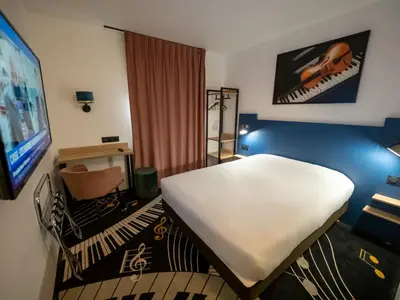 Un ou plusieurs lits dans un hébergement de l'établissement Welcomotel Beauvais Aéroport