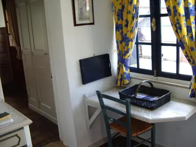 Télévision ou salle de divertissement dans l'établissement Le Four À Pain