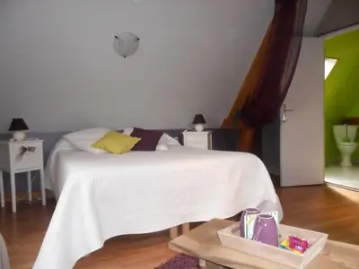 Un ou plusieurs lits dans un hébergement de l'établissement Chambre Du Panorama