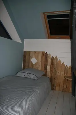 Un ou plusieurs lits dans un hébergement de l'établissement Gîte à la Ferme des Rooses