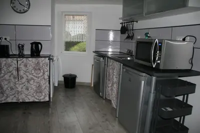 Cuisine ou kitchenette dans l'établissement Gîte à la Ferme des Rooses