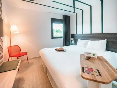Un ou plusieurs lits dans un hébergement de l'établissement ibis Styles Rouen Val De Reuil