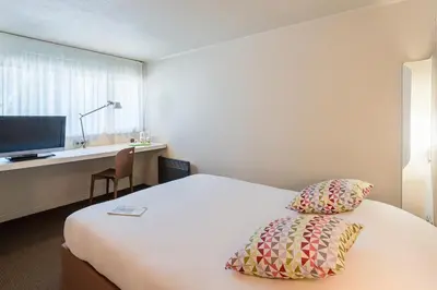 Un ou plusieurs lits dans un hébergement de l'établissement Campanile Rouen Sud - Zénith - Parc Expo