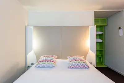 Un ou plusieurs lits dans un hébergement de l'établissement Campanile Rouen Sud - Zénith - Parc Expo