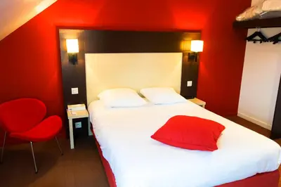 Un ou plusieurs lits dans un hébergement de l'établissement KYRIAD ROUEN NORD - Mont Saint Aignan