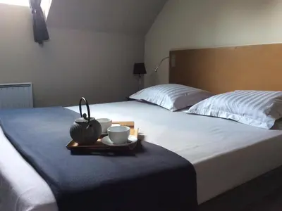 Un ou plusieurs lits dans un hébergement de l'établissement Manoir de La Muette