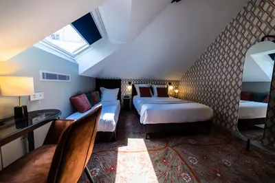 Un ou plusieurs lits dans un hébergement de l'établissement Hôtel Paulette Rouen Centre Cathédrale