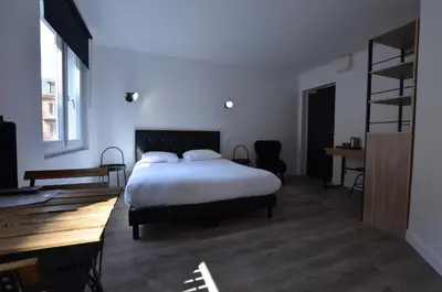 Un ou plusieurs lits dans un hébergement de l'établissement Hotel De Quebec