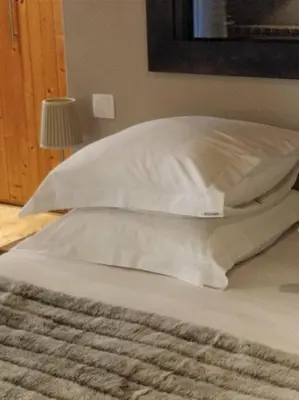 Un ou plusieurs lits dans un hébergement de l'établissement Clos Masure hôtel de campagne