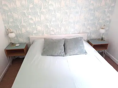 Un ou plusieurs lits dans un hébergement de l'établissement Magnolia Cottage