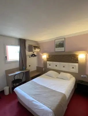 Un ou plusieurs lits dans un hébergement de l'établissement Kimotel Epône-Flins