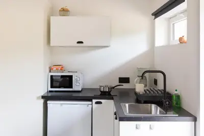 Cuisine ou kitchenette dans l'établissement La Pomme Pétillante