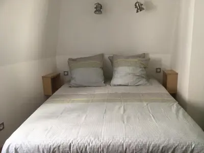 Un ou plusieurs lits dans un hébergement de l'établissement Duplex Little Cottage