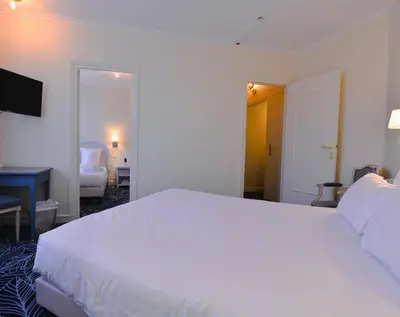 Un ou plusieurs lits dans un hébergement de l'établissement Hostellerie Saint Pierre