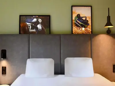 Un ou plusieurs lits dans un hébergement de l'établissement ibis Maisons Laffitte