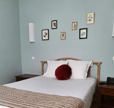 Un ou plusieurs lits dans un hébergement de l'établissement Hostellerie Du Lys