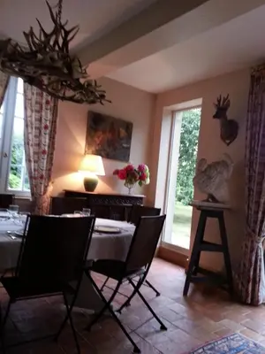 Coin salon dans l'établissement Chambre d'hotes de la Vallee