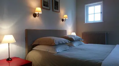 Un ou plusieurs lits dans un hébergement de l'établissement Chambre d'hotes de la Vallee