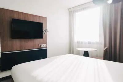 Un ou plusieurs lits dans un hébergement de l'établissement Ibis Rouen Centre Rive Gauche Mermoz