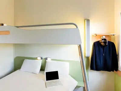 Un ou plusieurs lits dans un hébergement de l'établissement Ibis Budget Cergy St Christophe