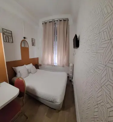 Un ou plusieurs lits dans un hébergement de l'établissement Hotel Central Anzac