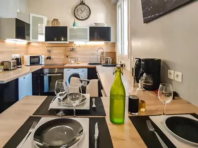 Cuisine ou kitchenette dans l'établissement Cosy'Appart - COEUR DE SEINE