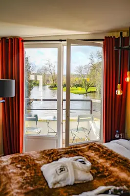 Un ou plusieurs lits dans un hébergement de l'établissement Hôtel-Restaurant Bel Ami