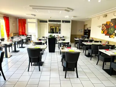 Restaurant ou autre lieu de restauration dans l'établissement Logis Hotel Altina