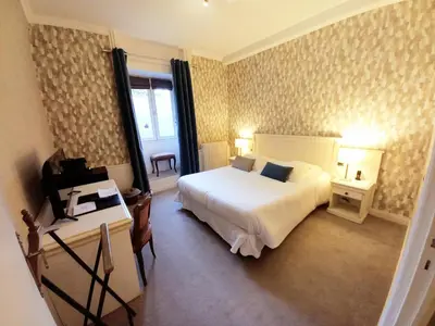 Un ou plusieurs lits dans un hébergement de l'établissement Domaine de Joinville & Spa