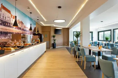 Restaurant ou autre lieu de restauration dans l'établissement Brit Hotel Confort Amiens
