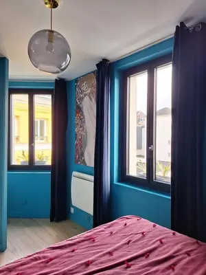 Un ou plusieurs lits dans un hébergement de l'établissement Appartement typique Rouen centre avec parking gratuit