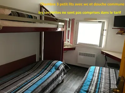 Un ou plusieurs lits dans un hébergement de l'établissement Class'Eco Chambly