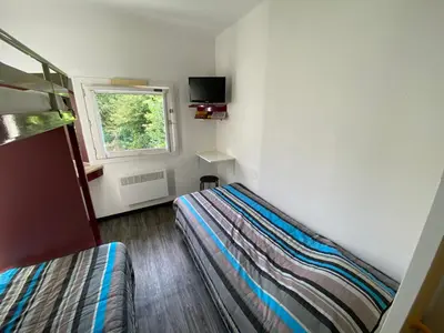Un ou plusieurs lits dans un hébergement de l'établissement Class'Eco Chambly