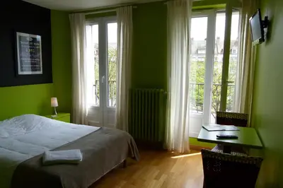 Un ou plusieurs lits dans un hébergement de l'établissement Hôtel Victor