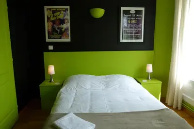 Un ou plusieurs lits dans un hébergement de l'établissement Hôtel Victor