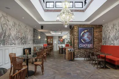 Coin salon dans l'établissement Hôtel Victor