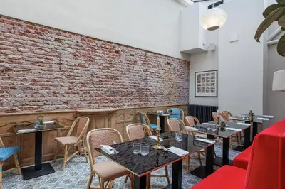 Coin salon dans l'établissement Hôtel Victor
