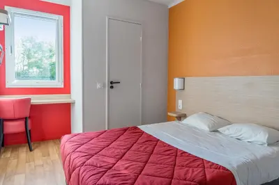 Un ou plusieurs lits dans un hébergement de l'établissement Premiere Classe Rouen Nord - Barentin