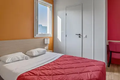 Un ou plusieurs lits dans un hébergement de l'établissement Premiere Classe Rouen Nord - Barentin