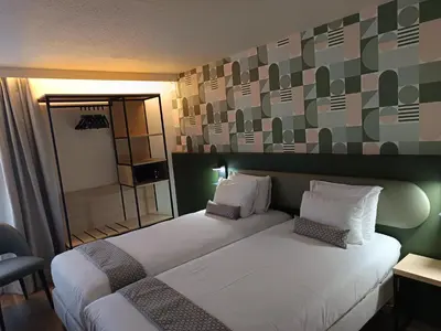 Un ou plusieurs lits dans un hébergement de l'établissement Hôtel Nell - Axelle - Maison Tassoni