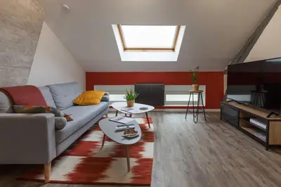 Coin salon dans l'établissement La Dimière - Appartements de standing en hyper-centre - Louviers
