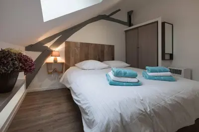 Un ou plusieurs lits dans un hébergement de l'établissement La Dimière - Appartements de standing en hyper-centre - Louviers