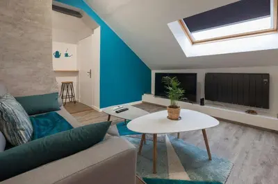 Télévision ou salle de divertissement dans l'établissement La Dimière - Appartements de standing en hyper-centre - Louviers