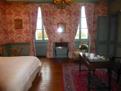 Un ou plusieurs lits dans un hébergement de l'établissement Chambres d'Hôtes de Manoir de Captot