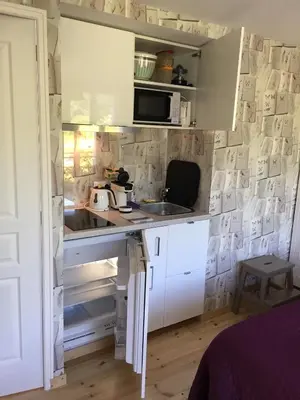 Cuisine ou kitchenette dans l'établissement Au Jardin des Deux Ponts
