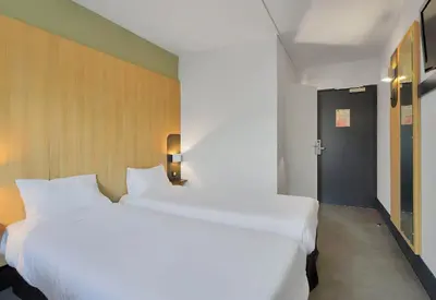 Un ou plusieurs lits dans un hébergement de l'établissement B&B HOTEL Le Tréport Friville